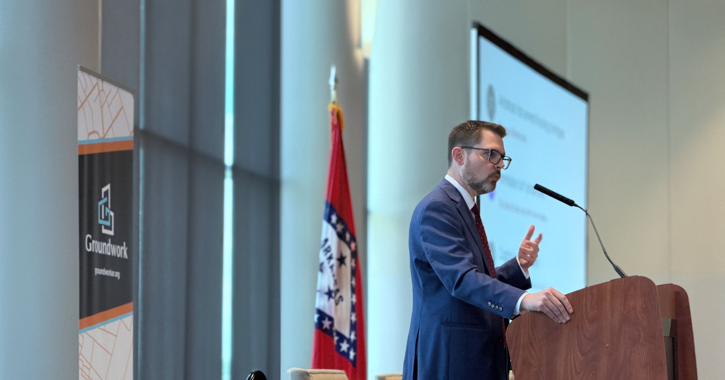 Mike Kingsella speaking at the Natural State Housing Summit, Robinson Center, Little Rock, October 1, 2026.