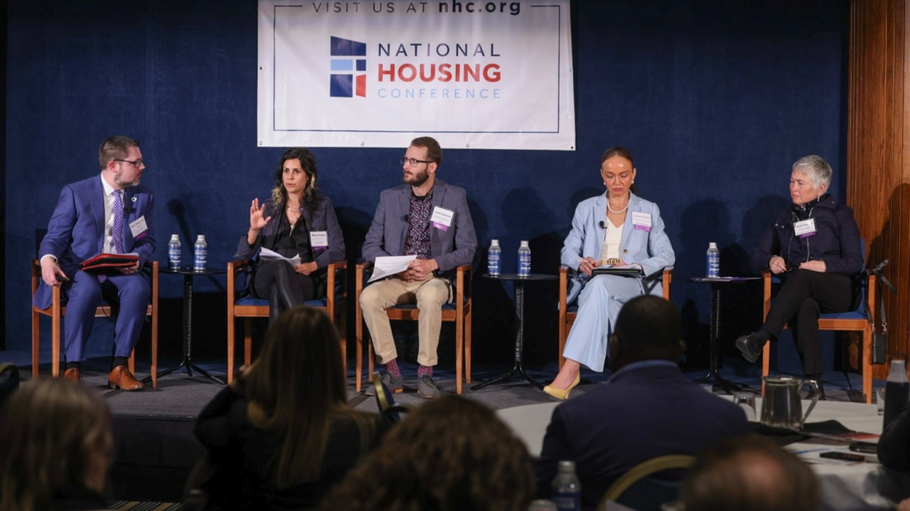 Panel discussion on housing policy and cross-sector consequences including health, equity, and transportation.
